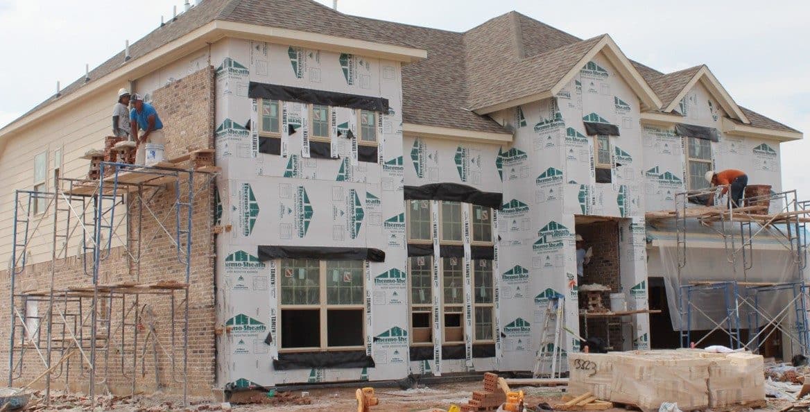 House under construction with paperboard exterior sheathing